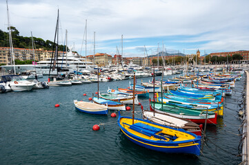 Fototapeta premium Traditional colorful fishing boats, called pointu in French. in Nice Port, Nice, France on sunny summer day.