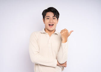 Portrait of young asian businessman wearing sweater and posing on white background