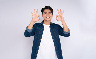 Portrait of young man 
Asian is posing on white background