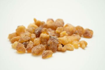 Frankincense or olibanum aromatic resin isolated on white background used in incense and perfumes.