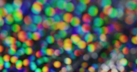 Naklejka premium Colorful sparkling. Confetti highlights. Iridescent surface with strobe disco effect. Variable dark background with spectral speckle dispersion.