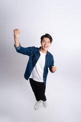 Full body image of a young man posing on a white background