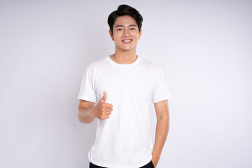 Portrait of an Asian guy posing on a white background