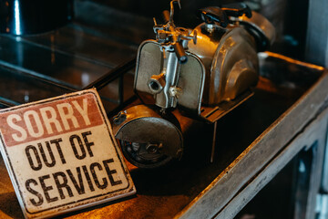 Antique Miniature Bike with 'SORRY OUT OF SERVICE' Sign