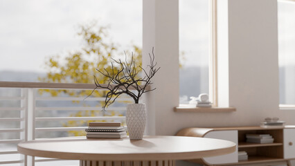 A comfortable contemporary relaxation area by the balcony featuring a round wooden coffee table.