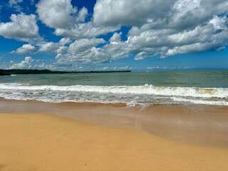 Deserted beach with natural sand and cloudy sky. Samana, Dominican Republic