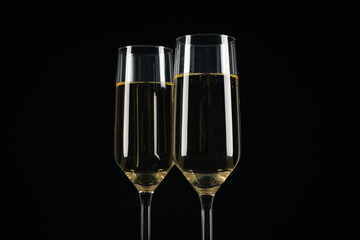 Champagne glasses on a black background