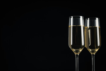 Champagne glasses on a black background