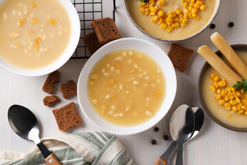 Corn soup in plates, top view, on a light background.