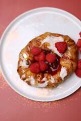 Sweet dessert on the white plates and red background with sparkles.