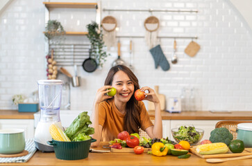 Portrait of beauty body slim healthy asian woman big smile cooking and preparing vegan food healthy holding apple, green apple, dental, teeth, fruit in kitchen at home.Diet.Fitness, healthy food