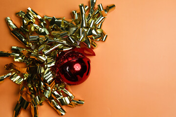 New Year wishes. Golden glitter with red ball . Christmas holiday background, copy space for your design