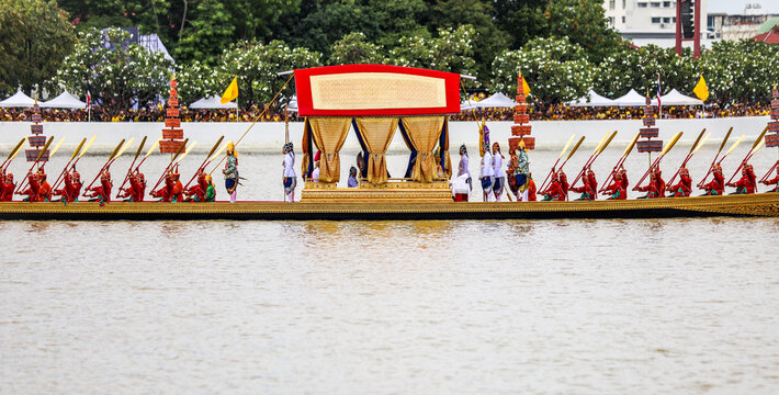 Bangkok, Thailand - October 27, 2024: Royal Kathin robe offering ceremony by royal barge procession at Wat Arun Ratchawararam with the royal barge Suphannahong sailing along the Chao Phraya River.