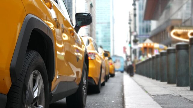 New York City Grand Central Terminal railway station, 42 street. Manhattan Midtown. Yellow taxi cab row, car transport on Pershing Square, NYC, USA. American urban road traffic, people pedestrians.