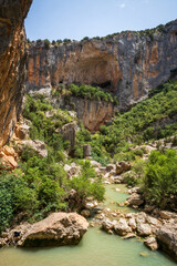 Pasarelas del Vero, walkways and footbridges along a scenic gorge with turquoise water in Alquézar, Huesca, Spain
