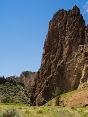 A mountain range with a large rock formation in the middle