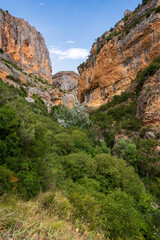 Pasarelas del Vero, walkways and footbridges along a scenic gorge with turquoise water in Alquézar, Huesca, Spain
