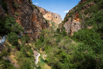 Pasarelas del Vero, walkways and footbridges along a scenic gorge with turquoise water in Alquézar, Huesca, Spain