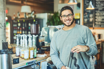 Man, portrait and cleaning at coffee shop, service and proud worker for hygiene in restaurant. Male...