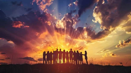 Fotobehang Silhouette of people embracing under a sky of unity © KerXing