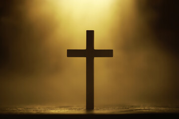 Silhouetted Cross Against Golden Glowing Backdrop Symbolizing Faith and Spirituality