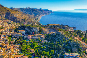 Aerial view of the Ancient theater of Taormina with Mount Etna in the background, Sicily, Italy