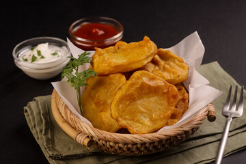 Allo Pakora or Pakoda is Indian Potatoes Fritters.  