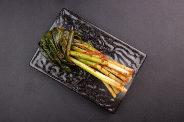 Pa Kimchi is Green Onion Kimchi in a Plate. 