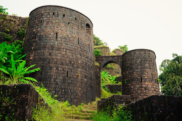 Yashwantgad Fort in Redi, Maharashtra, near the Maharashtra-Goa border. Green roots of trees grows...