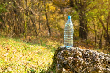Bottle of clean water in nature.