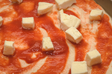 Homemade Pizza With Tomato And Mozzarella Cheese Before Baking