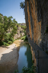 Pasarelas del Vero, walkways and footbridges along a scenic gorge with turquoise water in Alquézar, Huesca, Spain