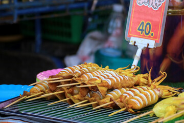 Cut the squid into bite-sized pieces, then skewer and grill.