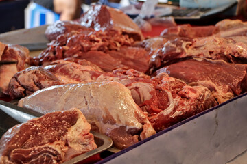 Close-up of cut pieces of meat on a table ready for sale.