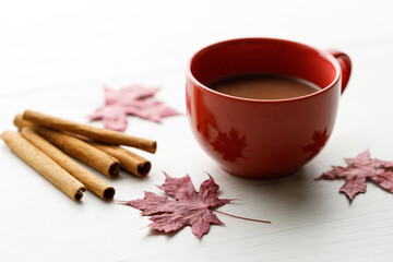 Cup of delicious hot chocolate on wooden table background.