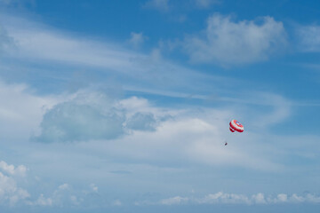 Parasailing in Blue Cloudy Skies