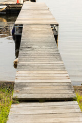 Obraz premium Vertical image of boat dock in a lake