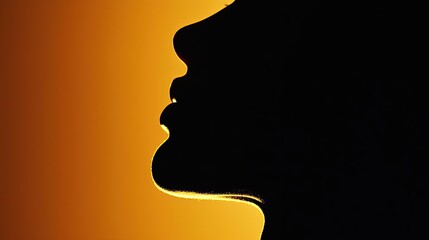 Silhouette of a person against a warm orange background.