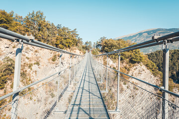 Hiking in autumn and discovery of the landscape of the Drac Himalayan footbridge, in Isère and the Auvergne-Rhône-Alpes region in France