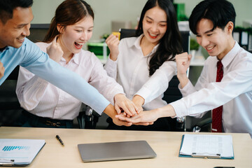 Happy businesspeople while collaborating on a new project in an office. Group of diverse businesspeople