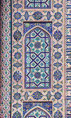 Vertical background with detail of ancient mosaic wall of Sher-dor Madrassah, Registan complex, Samarkand, Uzbekistan. Traditional iranian tile decorations