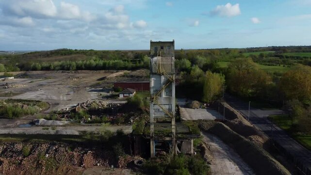 Low drone orbit of loading tower on an abandoned historic industrial coal processing plant that supplied many industries.