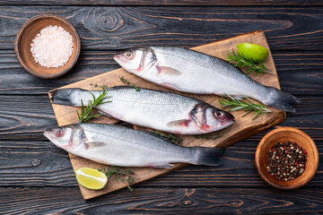 Raw sea bass fish photography . Top view