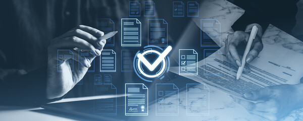 Hands with stylus reviewing documents, digital checkmarks overlay. Blue-toned style, business evaluation concept, approval process
