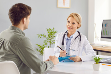 Positive doctor or nurse engages in a conversation with a patient during a hospital visit. Medical support, quality healthcare, and medicare in a professional and caring environment.