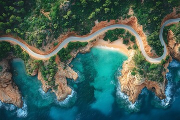 Winding coastal road leads to a secluded beach with turquoise water.