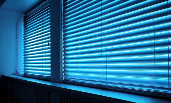 Modern blue blinds against a dark window background at night