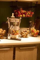 the buffet is filled with fruit, snacks, and beverages