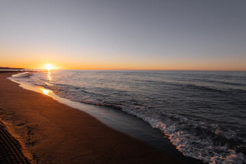 beautiful sunrise on the sea with waves