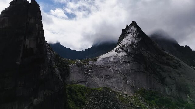 flying over rocks in the form of a parabola in the clouds